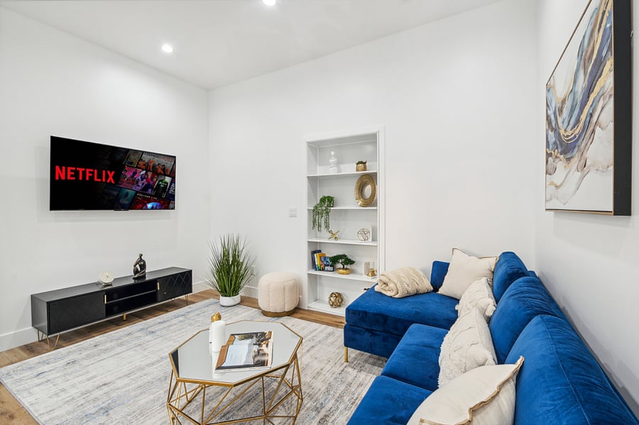 Comfortable living room with smart TV for long-term guests