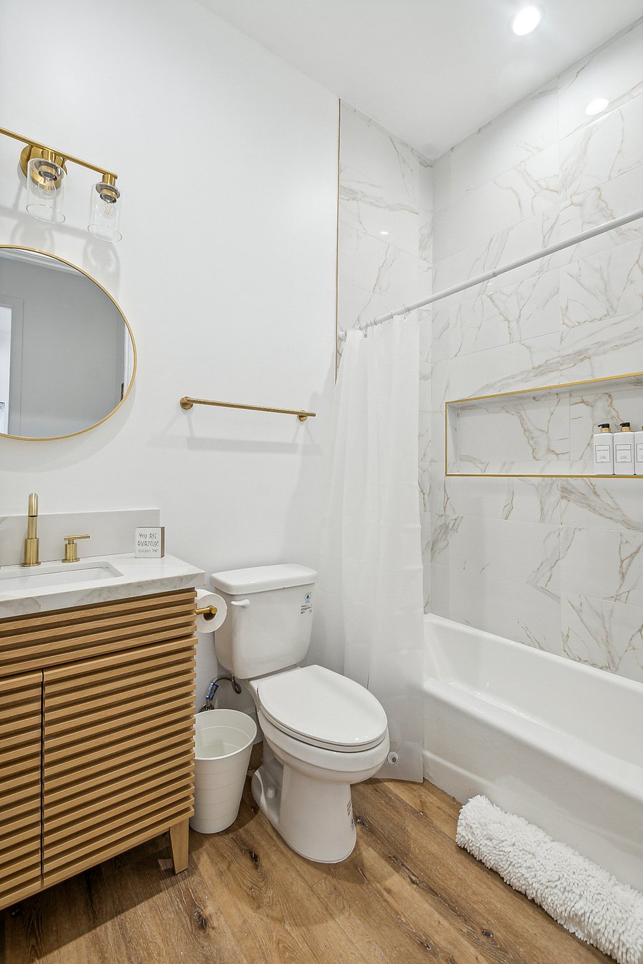 Clean modern bathroom with tub for relocation housing