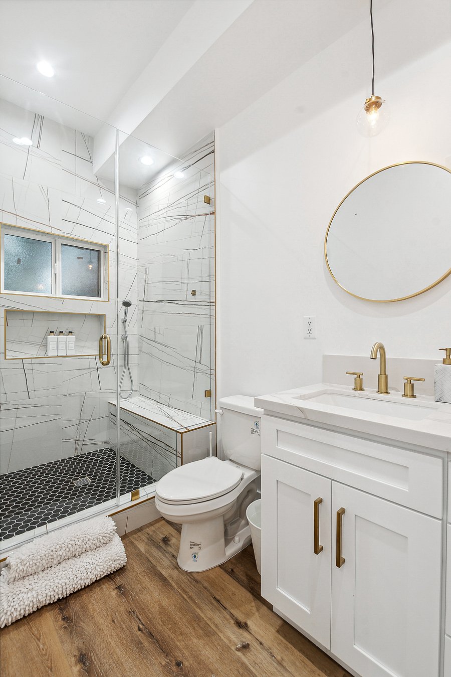 Clean updated bathroom with towels and supplies provided