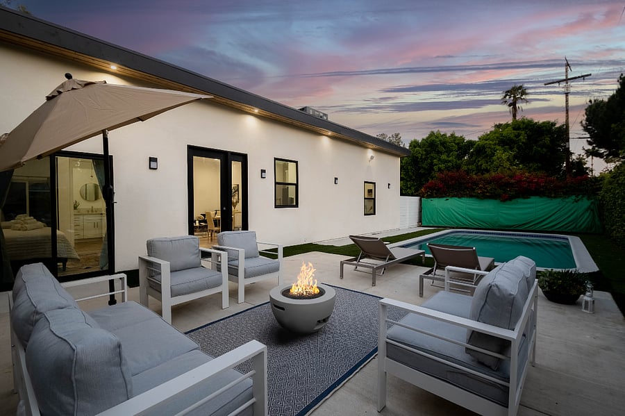 Outdoor lounge with firepit for long-term stays