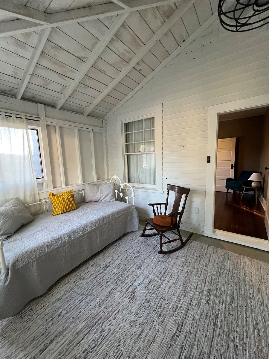 The uninsulated sunroom is access through bedroom 2, or through an exterior door.