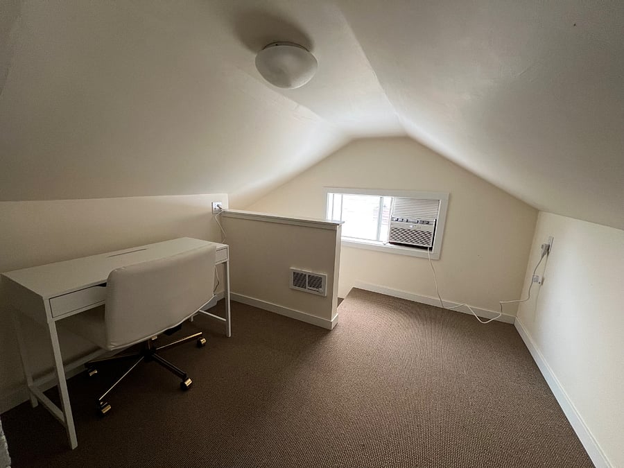 Upstairs office space - note the very low ceilings. Heater cadet and window AC