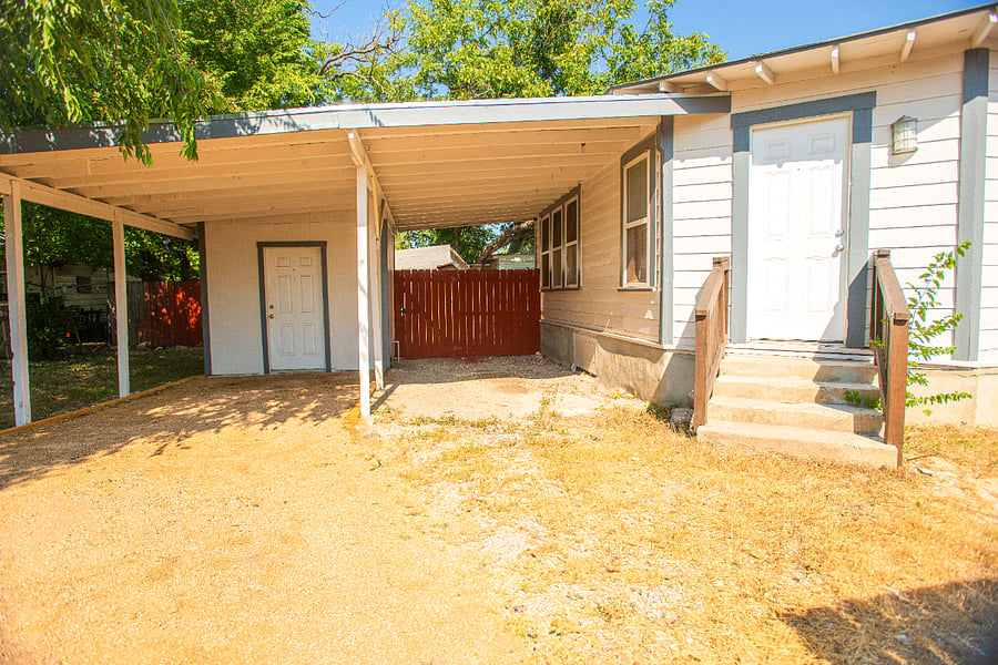 One designated parking spot on the right side of the carport. 