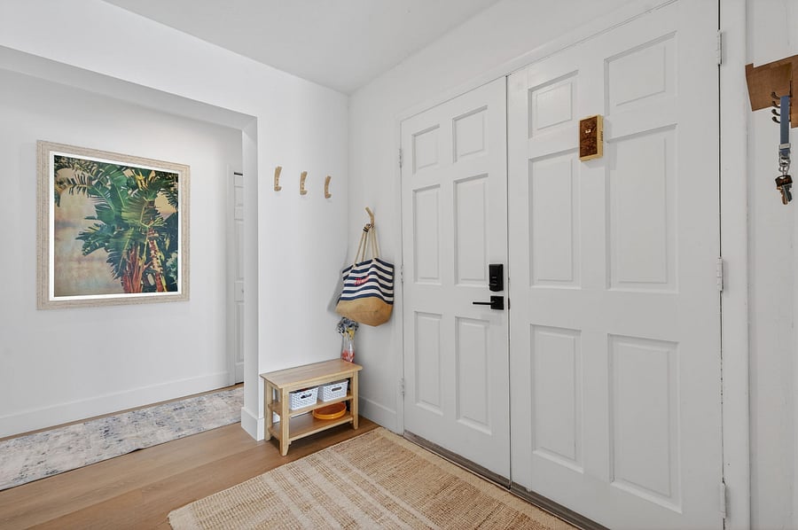 Entryway with places for shoes, beach towels, and beach bags