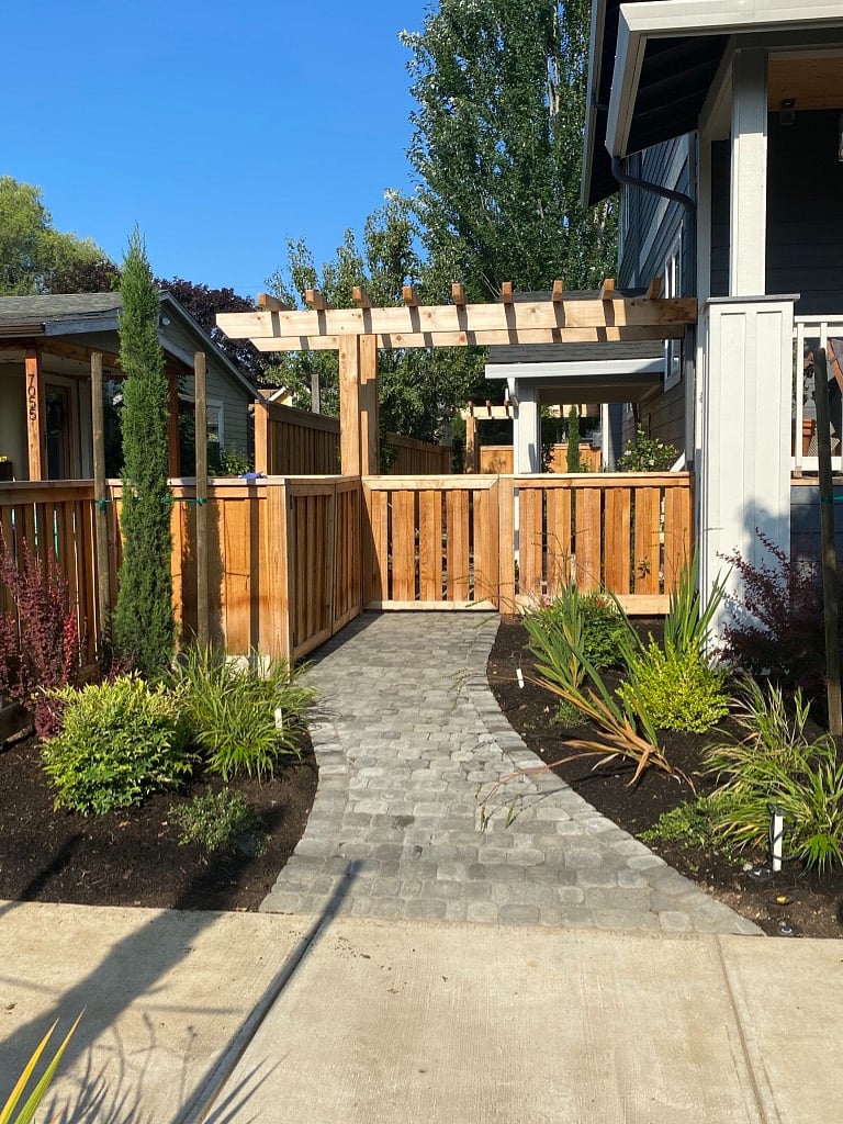 Walk through your private entrance with fenced patio and garden area