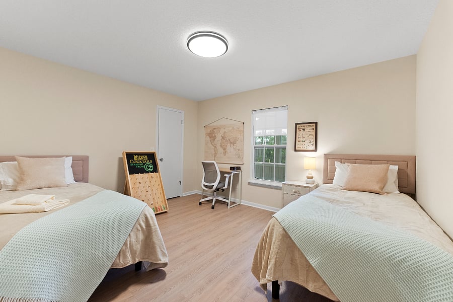 This flexible guest room offers two full beds, a cozy workspace, and a peaceful atmosphere perfect for rest or quiet productivity. Ideal for kids, companions, or remote workfeaturing warm lighting, neutral tones, and curated details throughout.