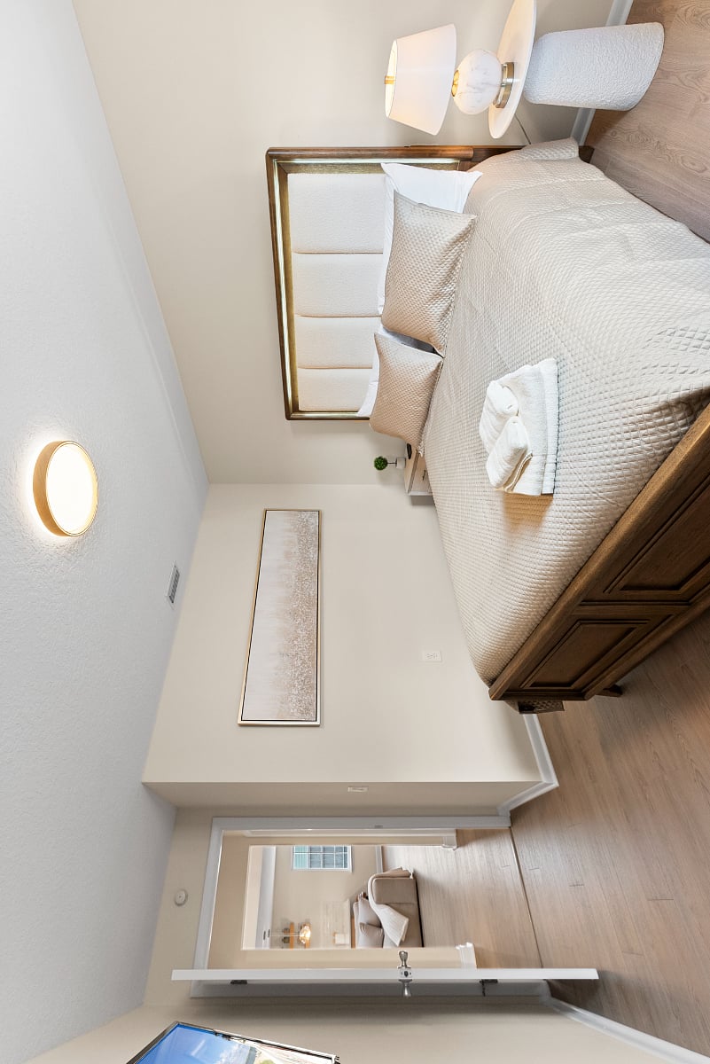 Another view of the main guest room, showcasing its elegant design and soothing layout. With a supportive bed, soft linens, smart TV, and calming tones throughout, its a cozy, luxurious space designed for restful sleep and peaceful recovery.