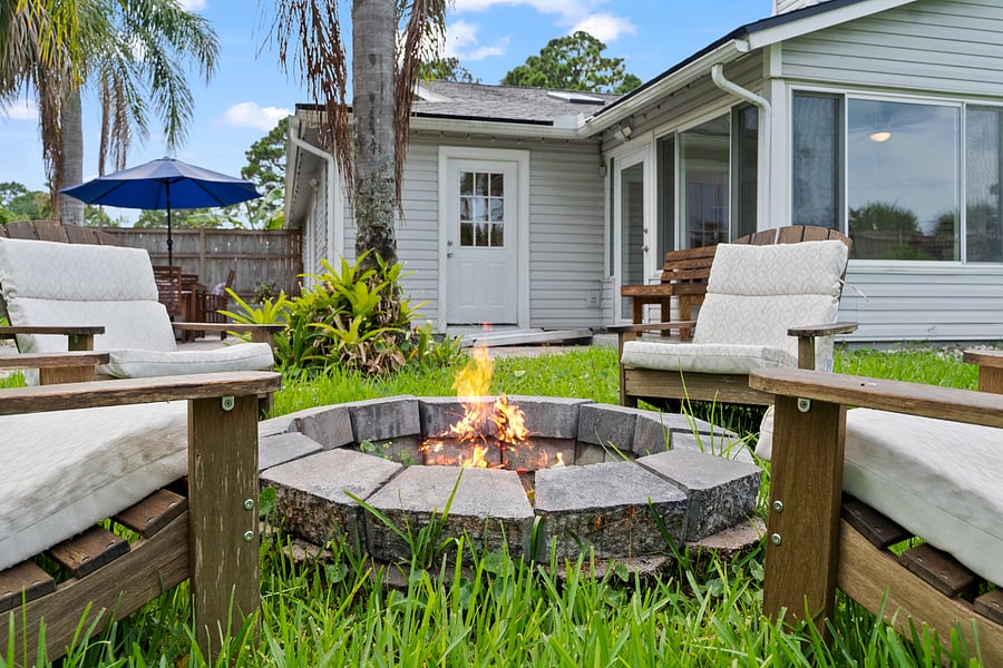 Gather around this beautiful stone firepit, surrounded by cushioned Adirondack chairsperfect for unwinding, sharing stories, and finding peace with loved ones in a calming, natural setting.