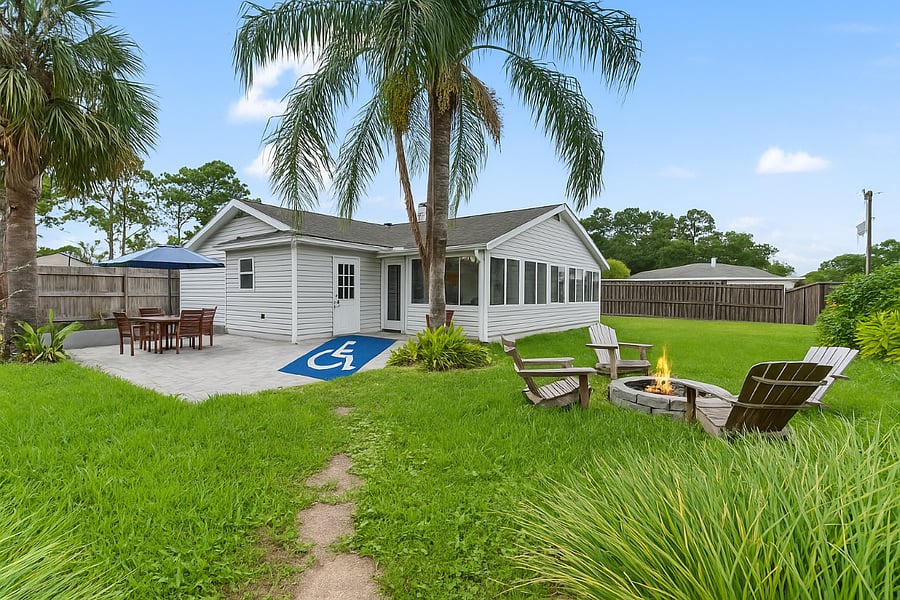 Wheelchair-accessible ramp to the backyard, offering smooth, easy access to outdoor spaces for relaxation, connection, and recovery.