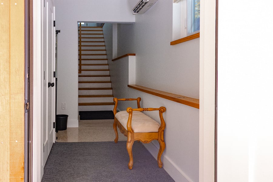 Lower entrance leads to indoor stairs 