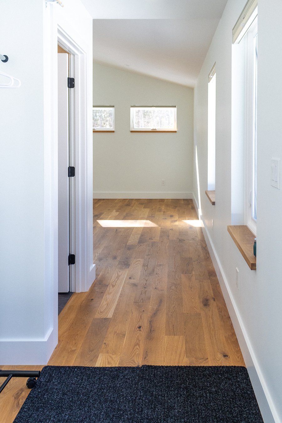 Upstairs hallway to bathroom and living space