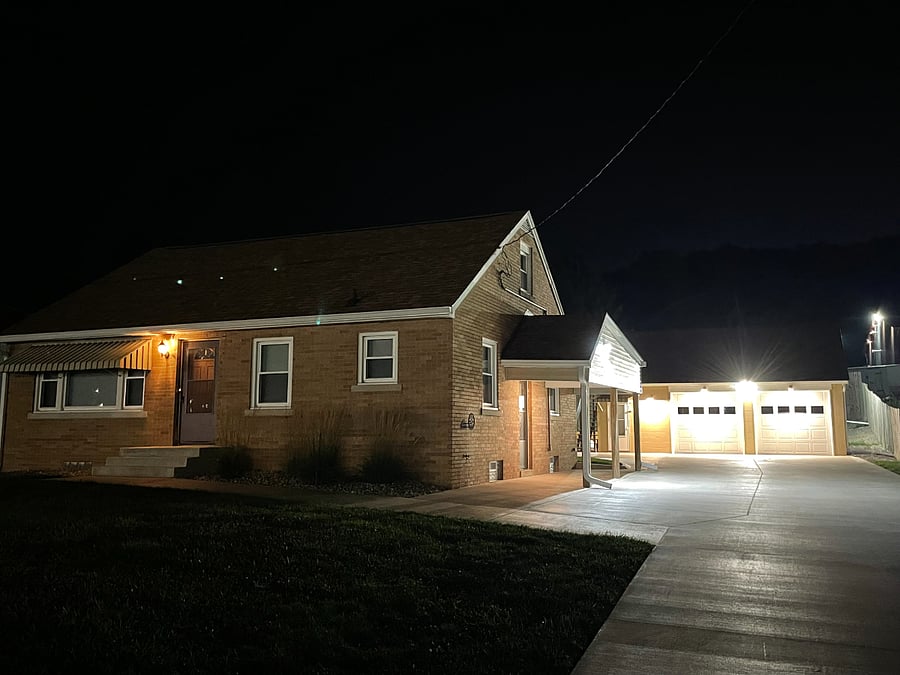 home, garage and yard well lit at night