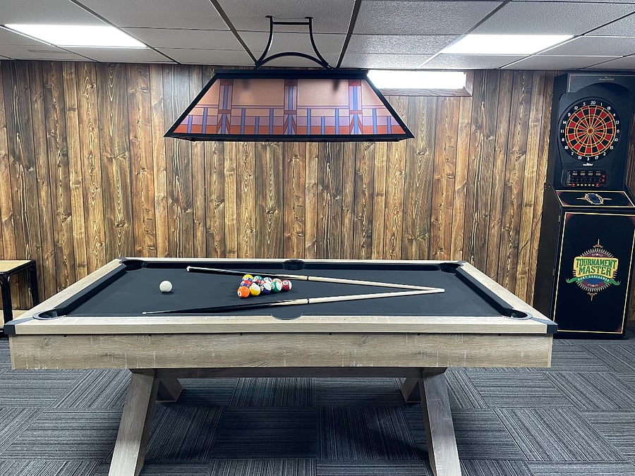 pool table and darts machine on lower level