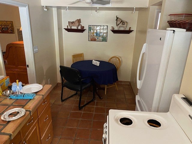 Dinette in kitchen.  Gas range, microwave