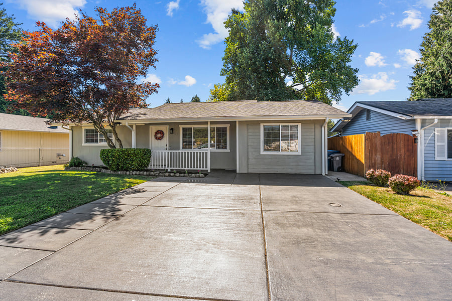2 car driveway with 2 spaces on the street in front of the house.