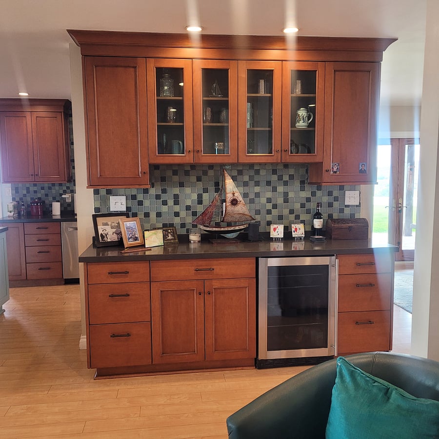 Bar with wine refrigerator.