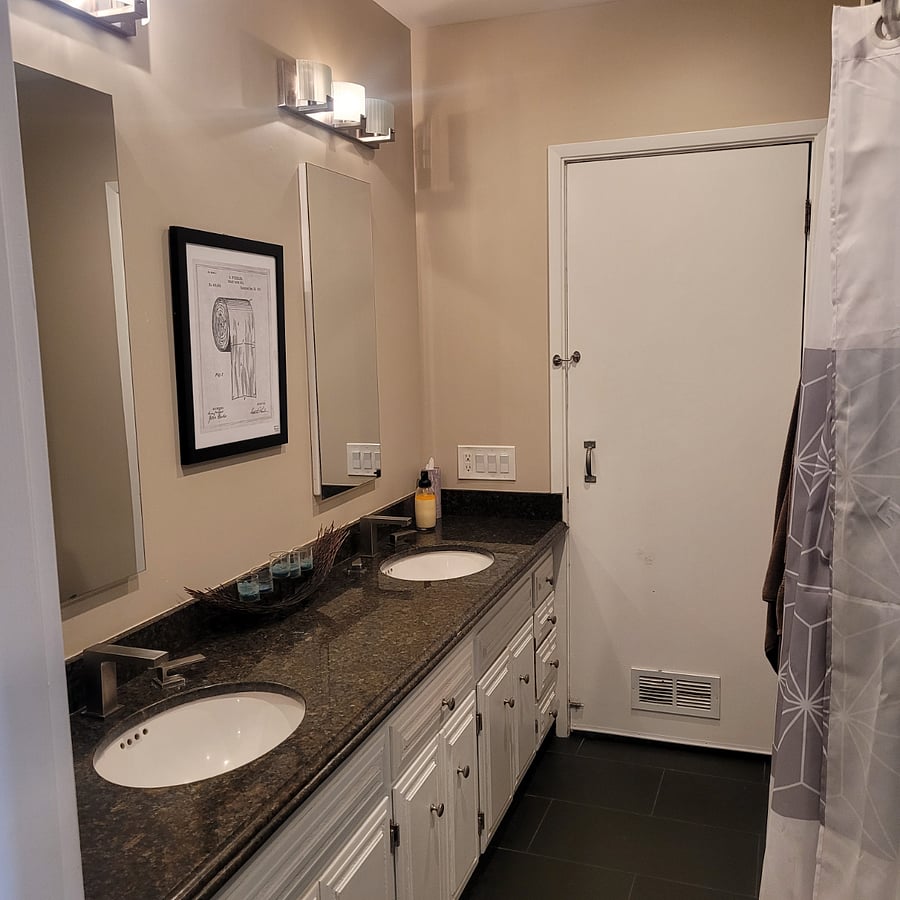 Full size bath with shower/bath combo. 