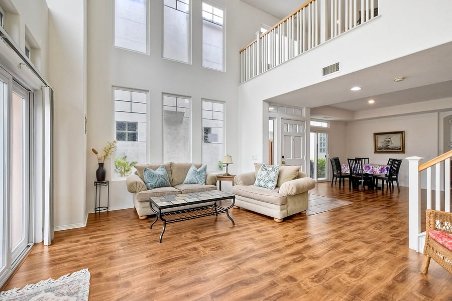 The spacious formal living room is perfect for entertaining or relaxing with natural light