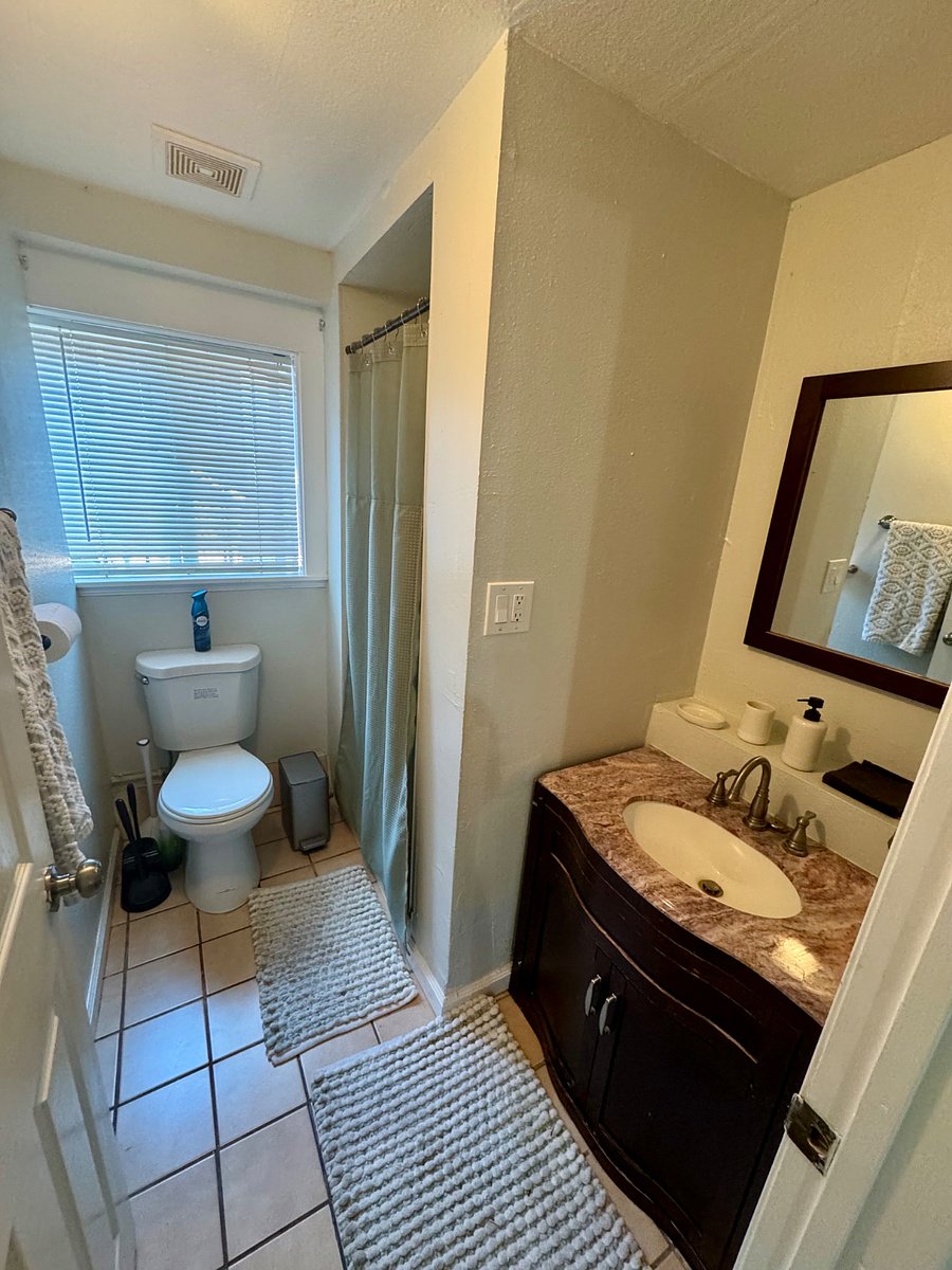Bathroom offers a standing shower stall.