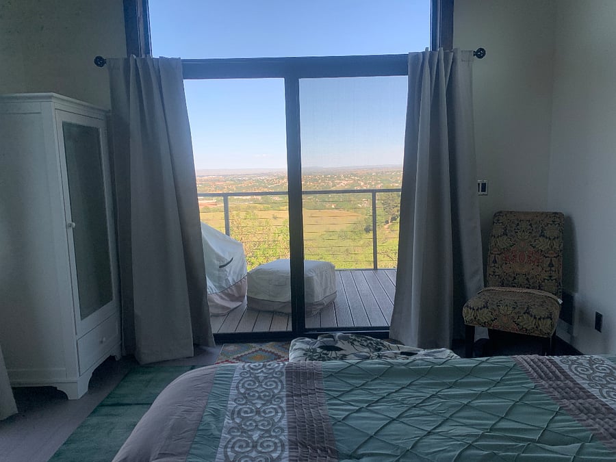 Bedroom with deck access and sunrise views 