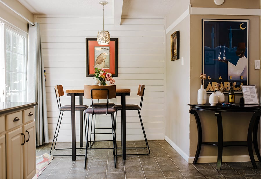 Breakfast nook by the kitchen slider out to the deck overlooking the garden. Great place for coffee.