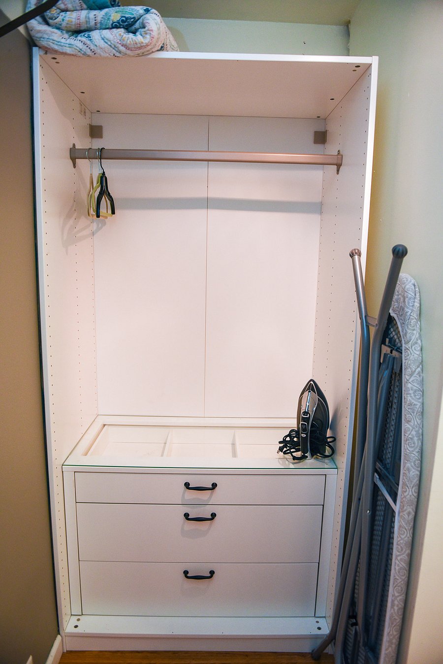 Main bedroom has a walk-in closet with two closets. Ironing board and iron.