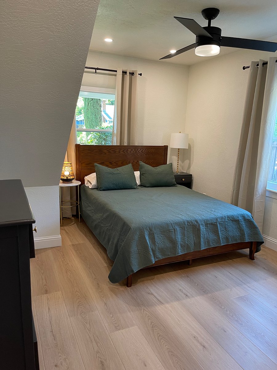 Master bedroom with walk-in closet and queen bed