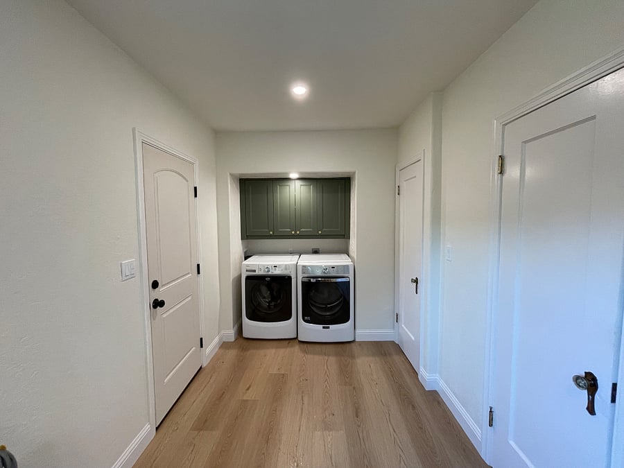 Laundry room with washer and dryer, a work space, extra closet and pantry.