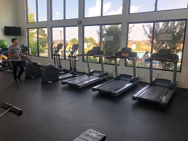 Gym - Included, aces via Key Fob, about a 2 minute walk from the front of the house. Open 5 AM - 11 PM.
