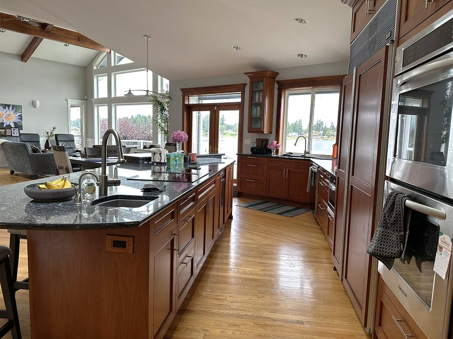 Kitchen looking toward living room and access to deck overlooking the lake.