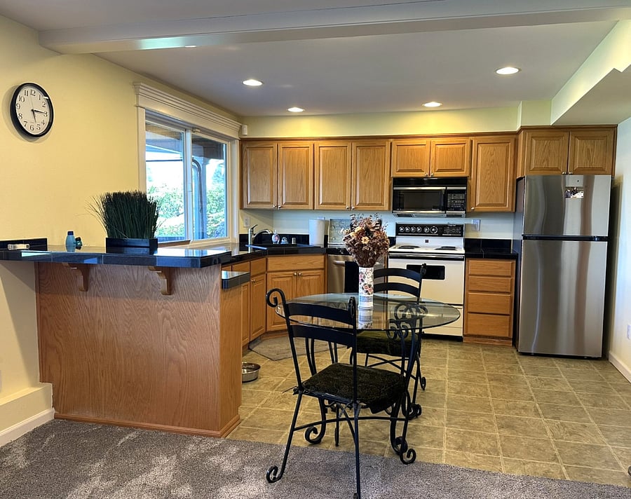 Full kitchen located on the lower level. Access to the lawn and lake is from sliding doors at this location.