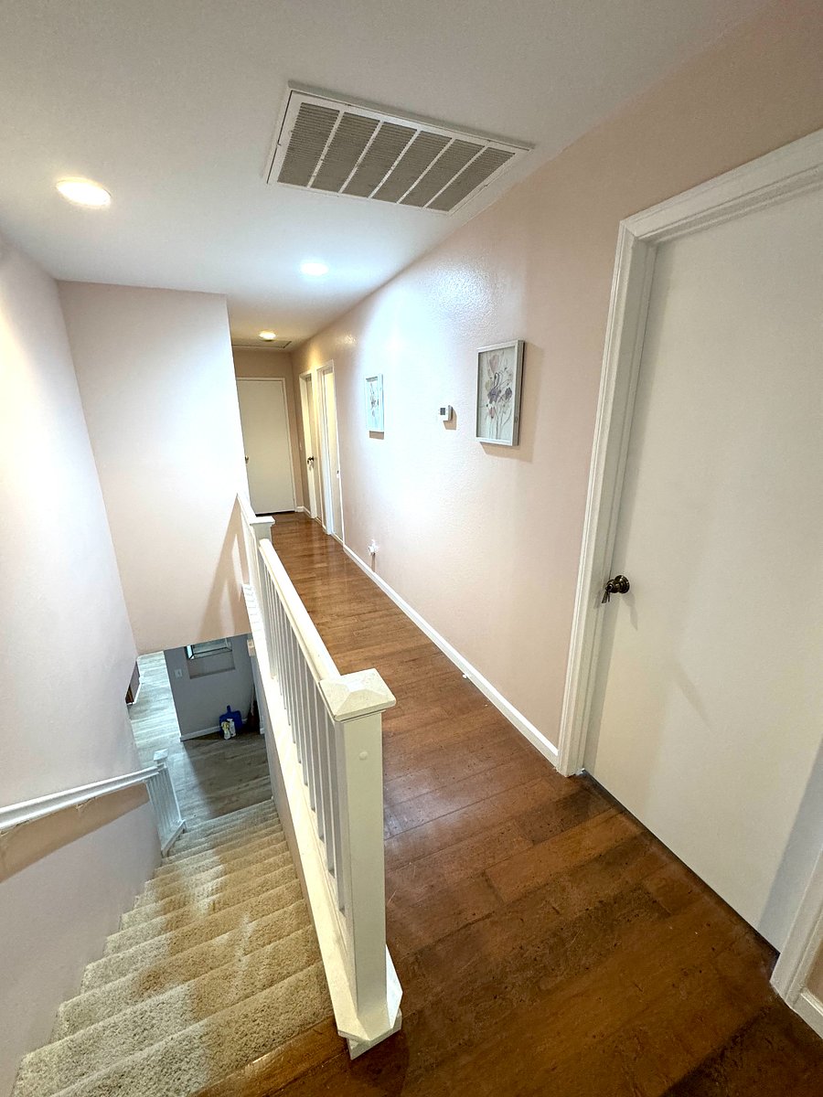 Hallway leading upstairs room