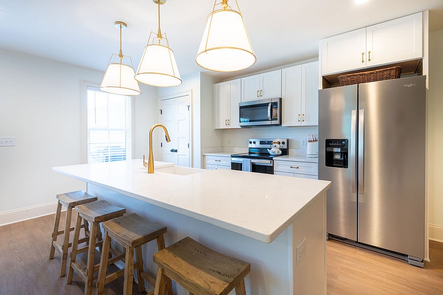 Large island in the kitchen provides extra space for eating and food prep.