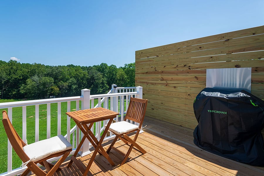 Enjoy your morning coffee or a meal at the bistro table on the deck with beautiful views. The wall on the deck was built to provide additional privacy.