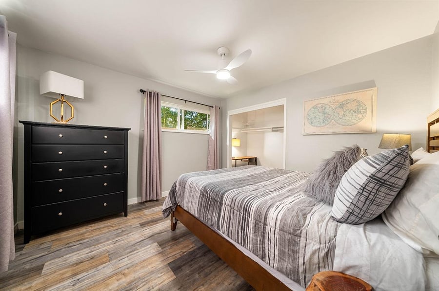 Bedroom two, with queen bed, two sets of sheets set. Closet with Iron board and working console.