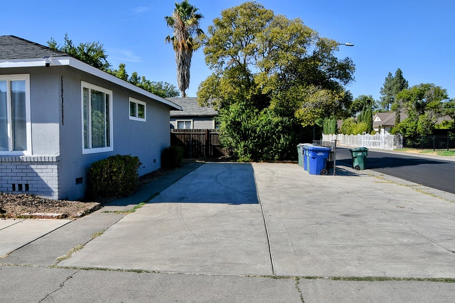Private parking side view, with per unit garbage cans.