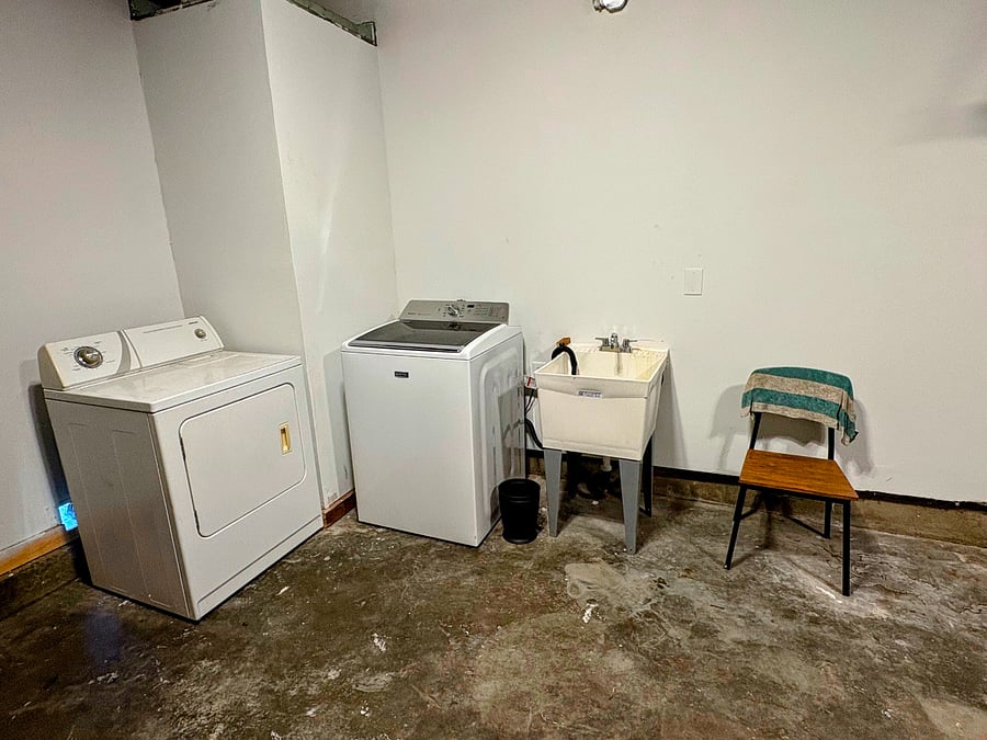 Washer and Dryer and laundry detergent provided along with utility sink.