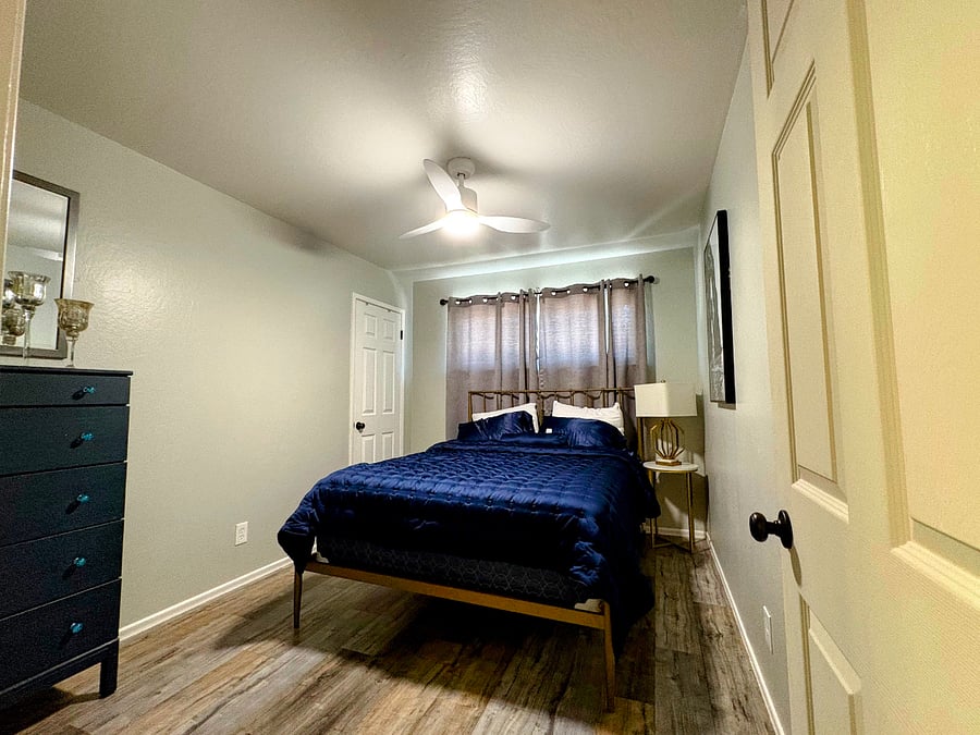 Bedroom with room darkening shades.