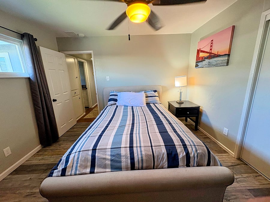 Bedroom One, with Queen Bed, 2 sets of sheets. Dresser, Side table with Lamp