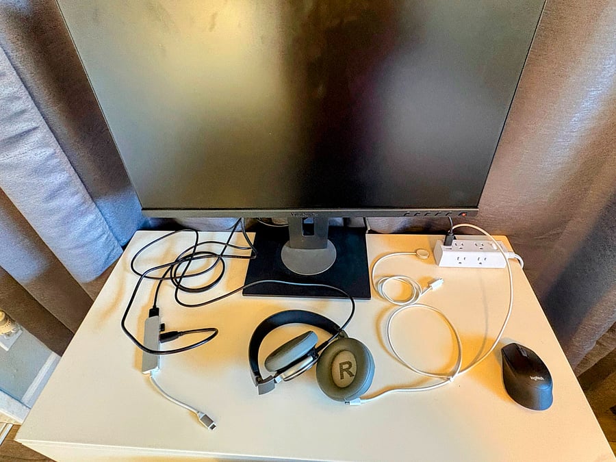 Working console in the closet with full display monitor, extension with wireless head set and wireless mouse. Simply connect Laptop USB-C connector. Power surge extension cord to connect additional accessories.
