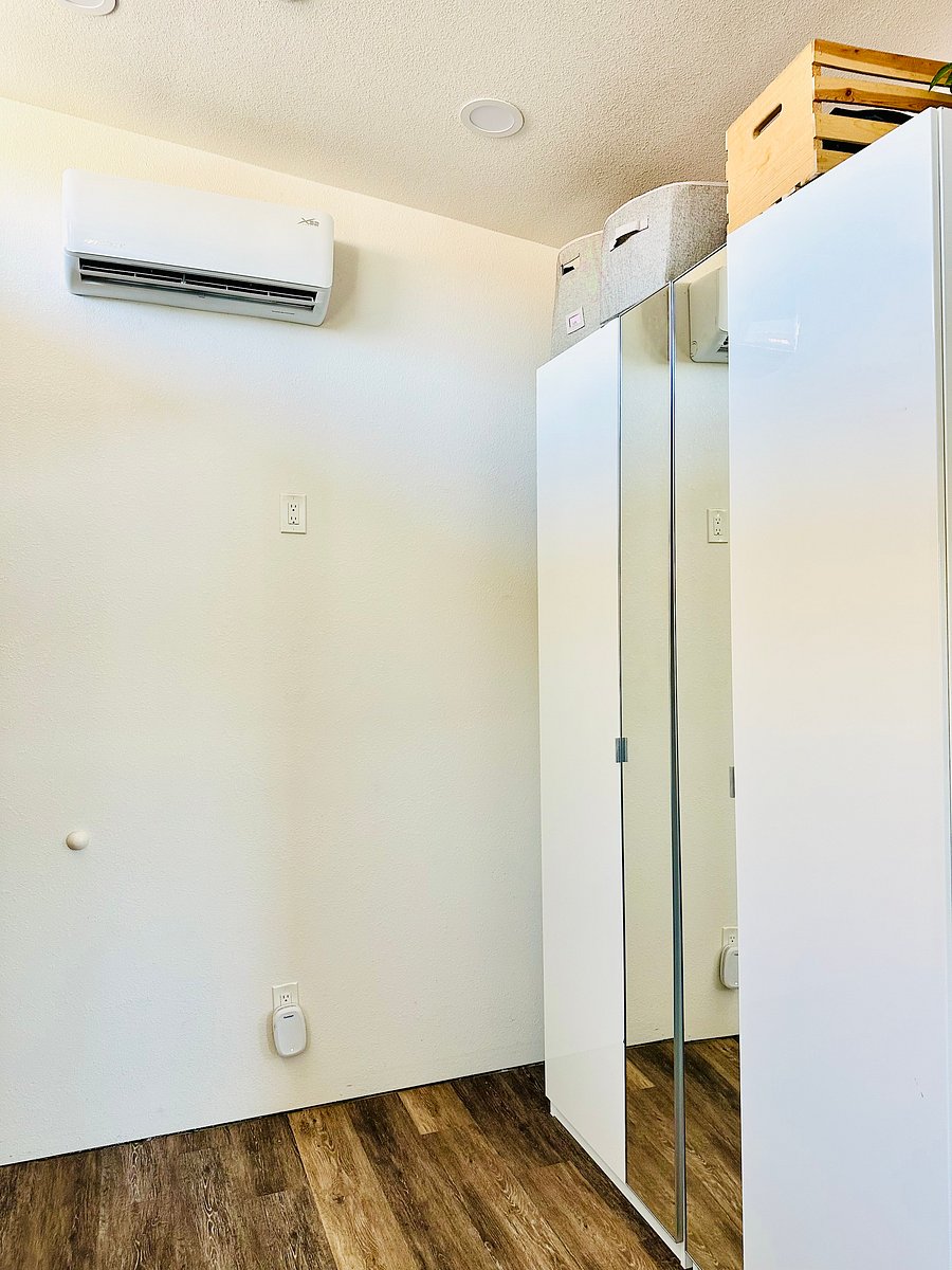 Side by side closets include shelves and drawers