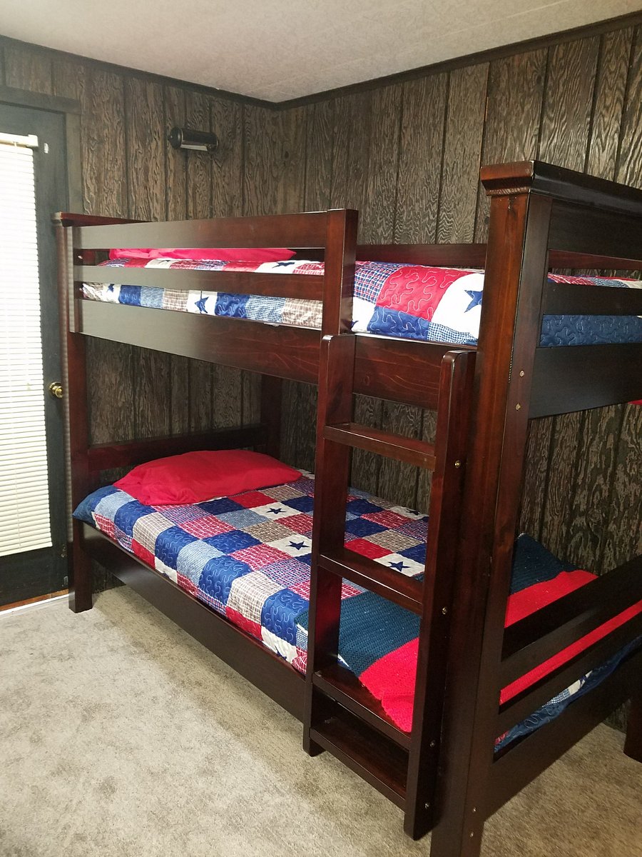 room with twin bunk beds and work space. This room is only accessible through the main bathroom and the bedroom with the queen bed. 