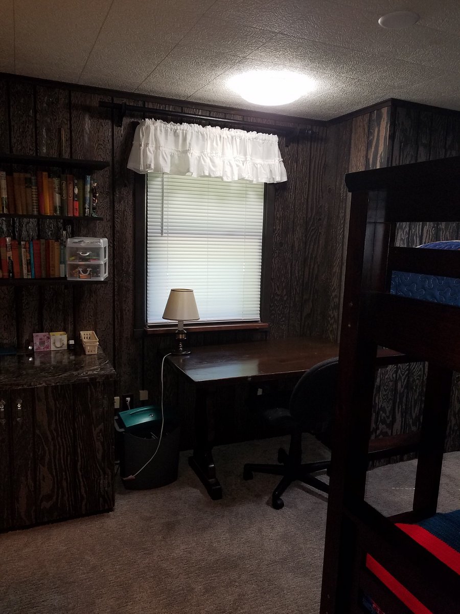 work space in bedroom with twin bunk beds.