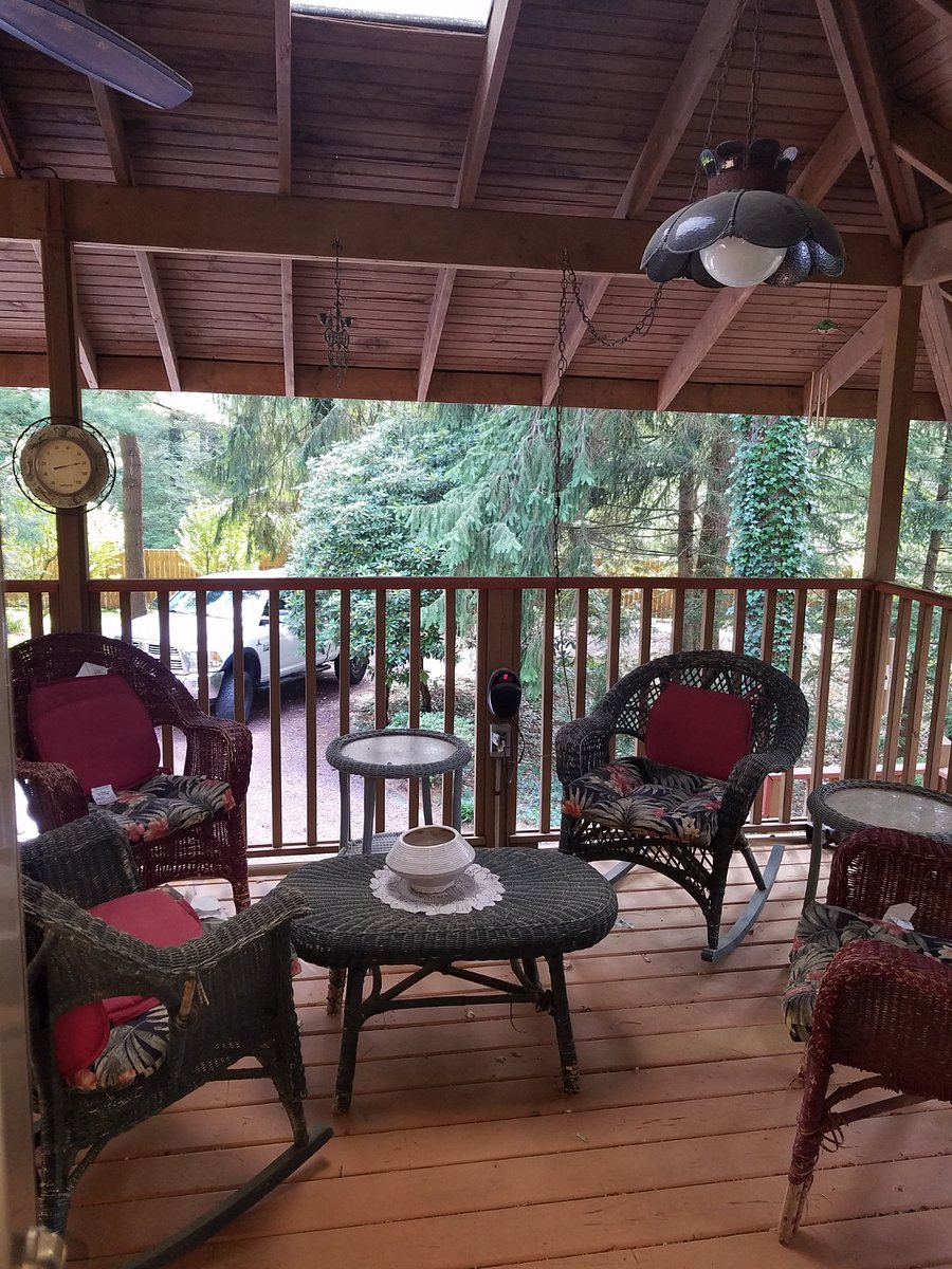 Covered porch accessible from dining room.