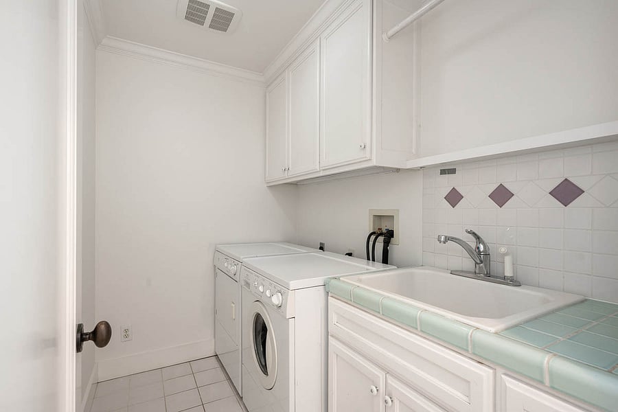 Seperate room for laundry w/ washer / dryer / storage