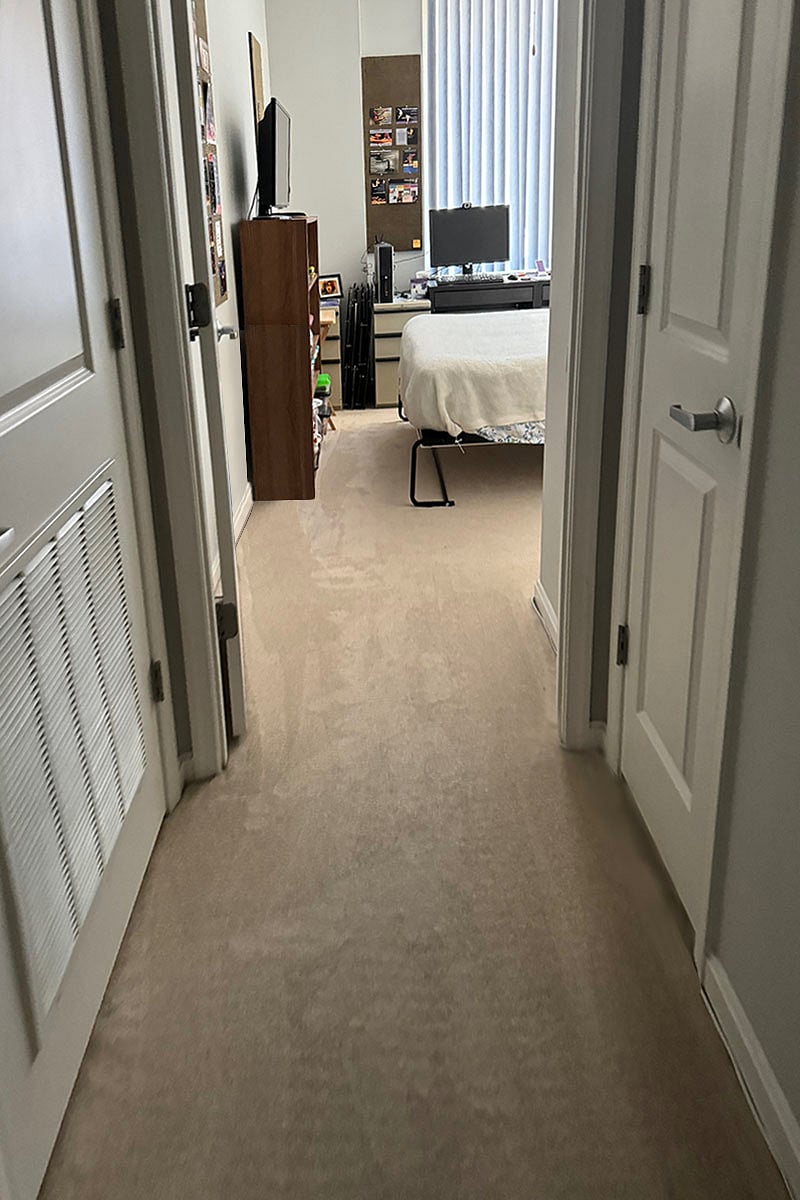 View into Bedroom f/corridor. Washer Dryer door on left Linen Closet on right.