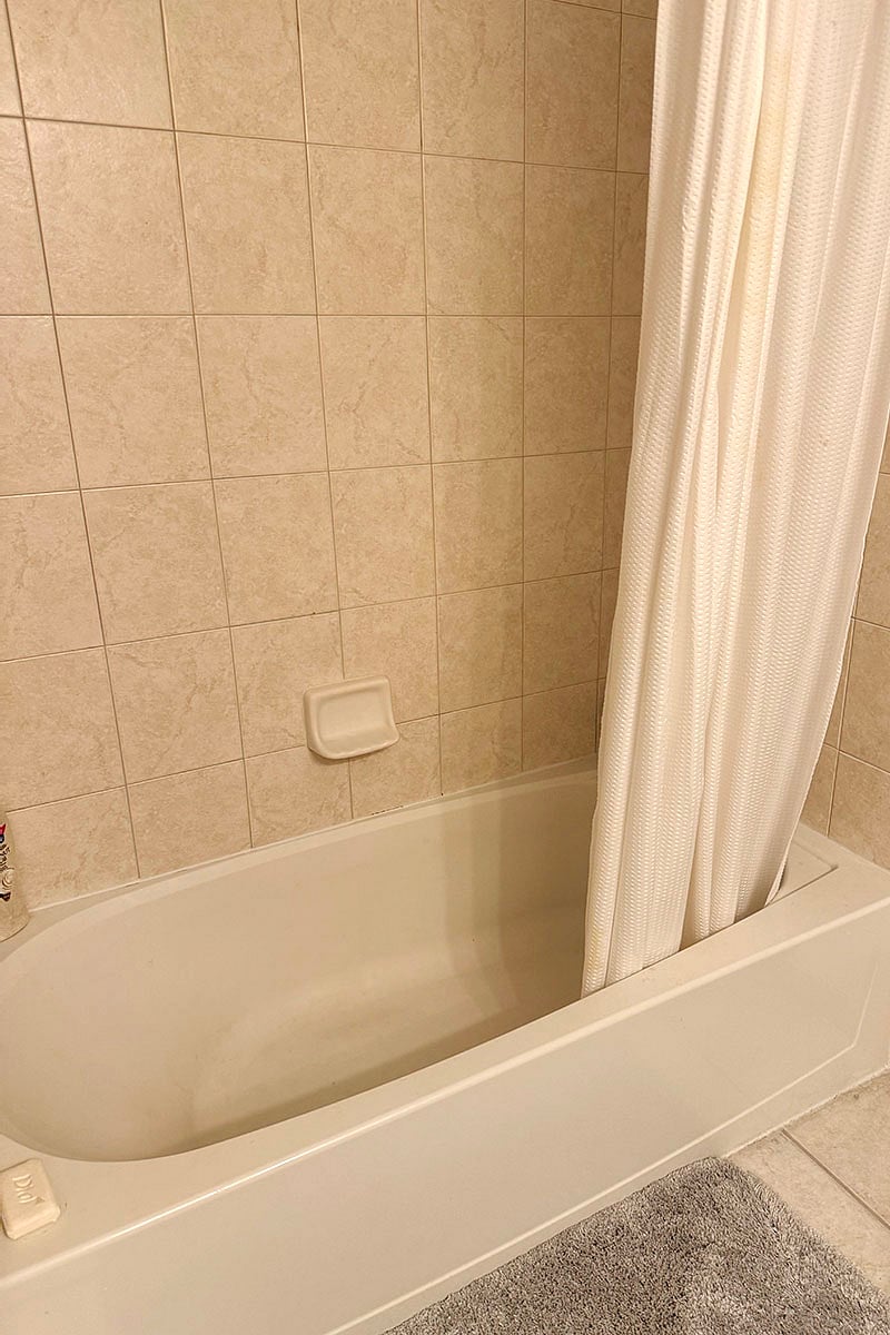 Tub is to the left of the Toilet.