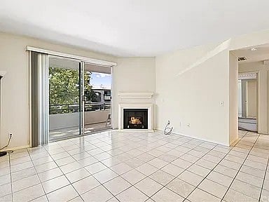 balcony surrounded by trees. natural sunlight throughout the day.