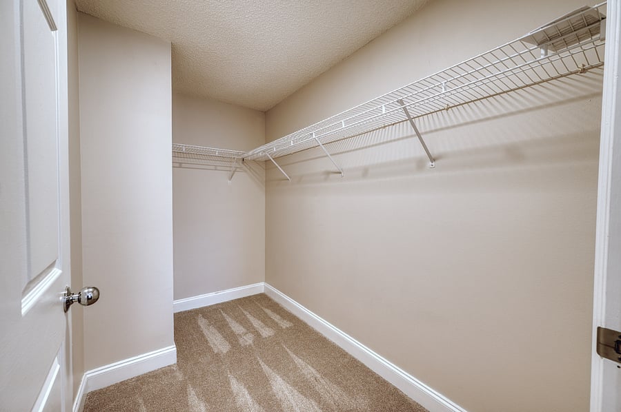 Primary bedroom walk-in closet