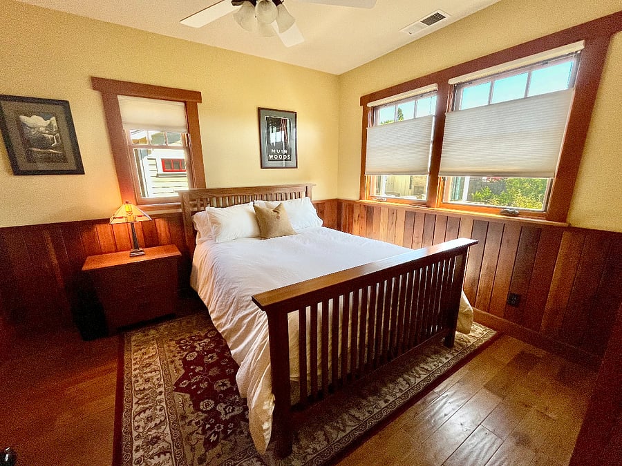 Main bedroom includes queen-sized bed, 100% cotton linens and luxury duvet.